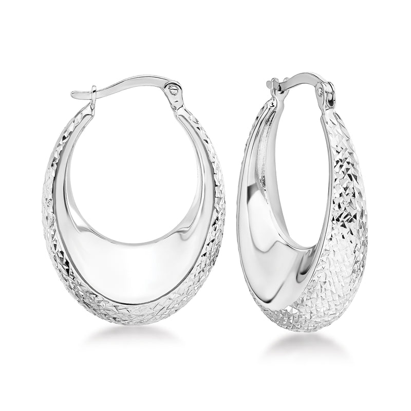 Oval hoop earrings in 14kt white gold with diamond-cut textured front.