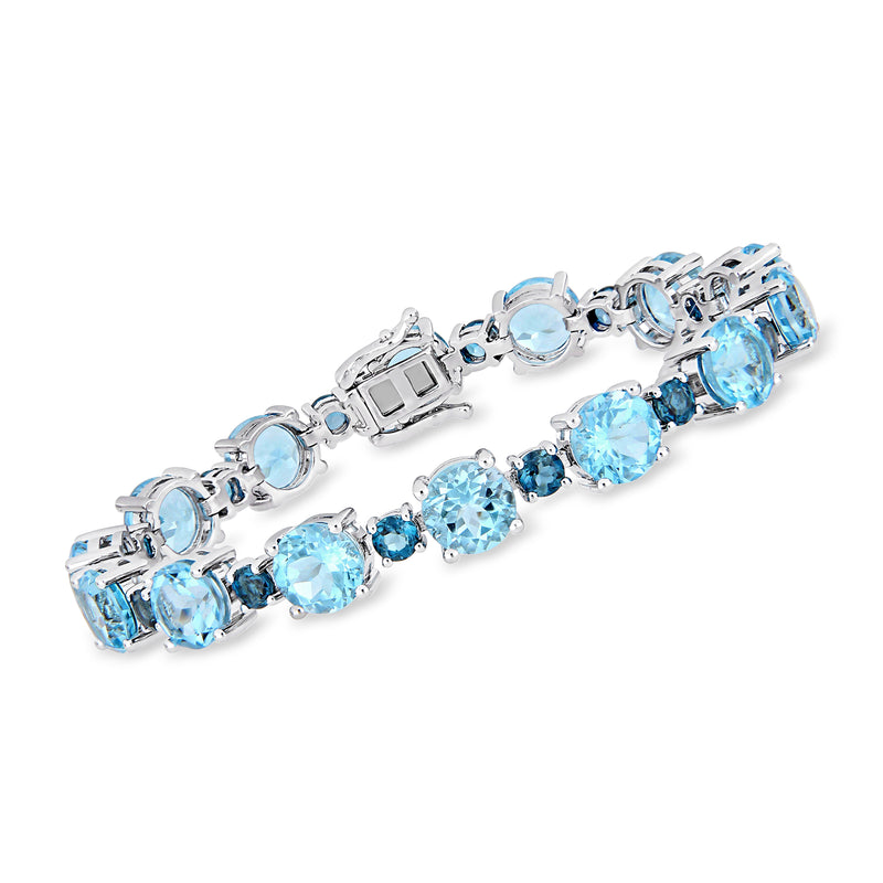 Sterling silver topaz bracelet with light blue gemstone stations and linked settings