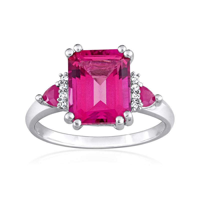 Sterling silver ring with large pink topaz center and diamond accents along the sides