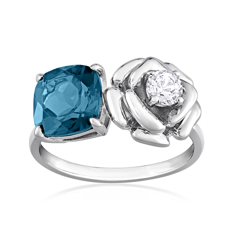 Sterling silver ring with large London-blue cushion topaz and white topaz flower