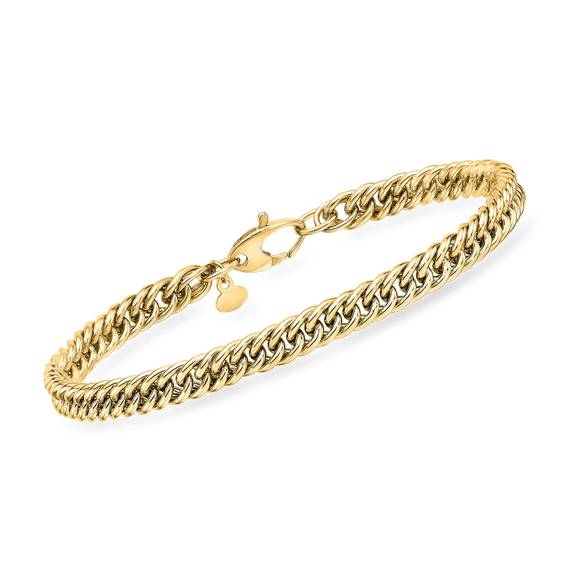 14kt yellow gold curb-link bracelet with lobster clasp and heart charm accents
