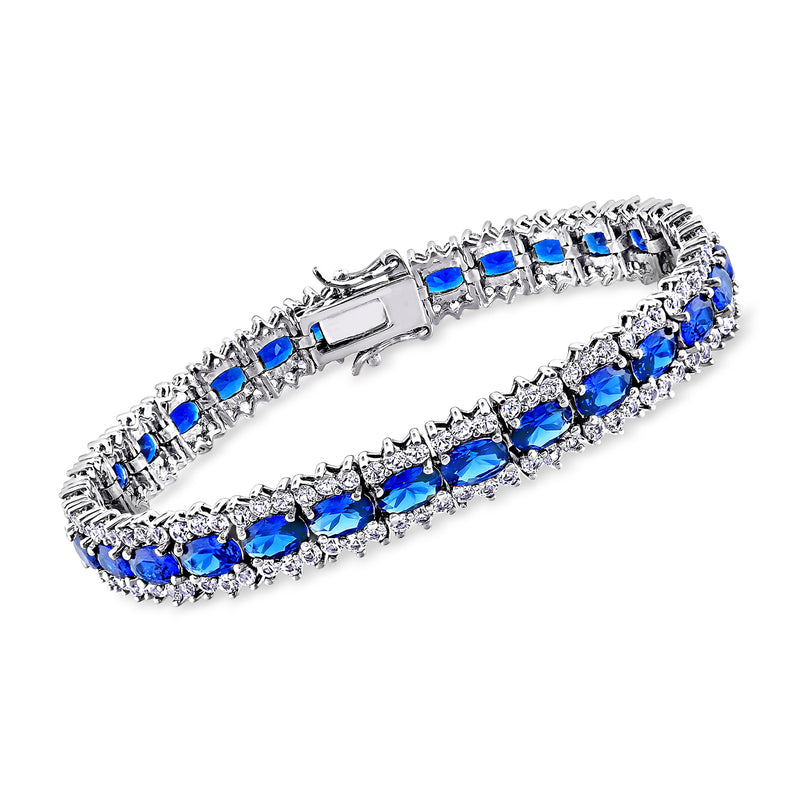 Sterling silver bracelet with blue and clear sapphire-style stones in row
