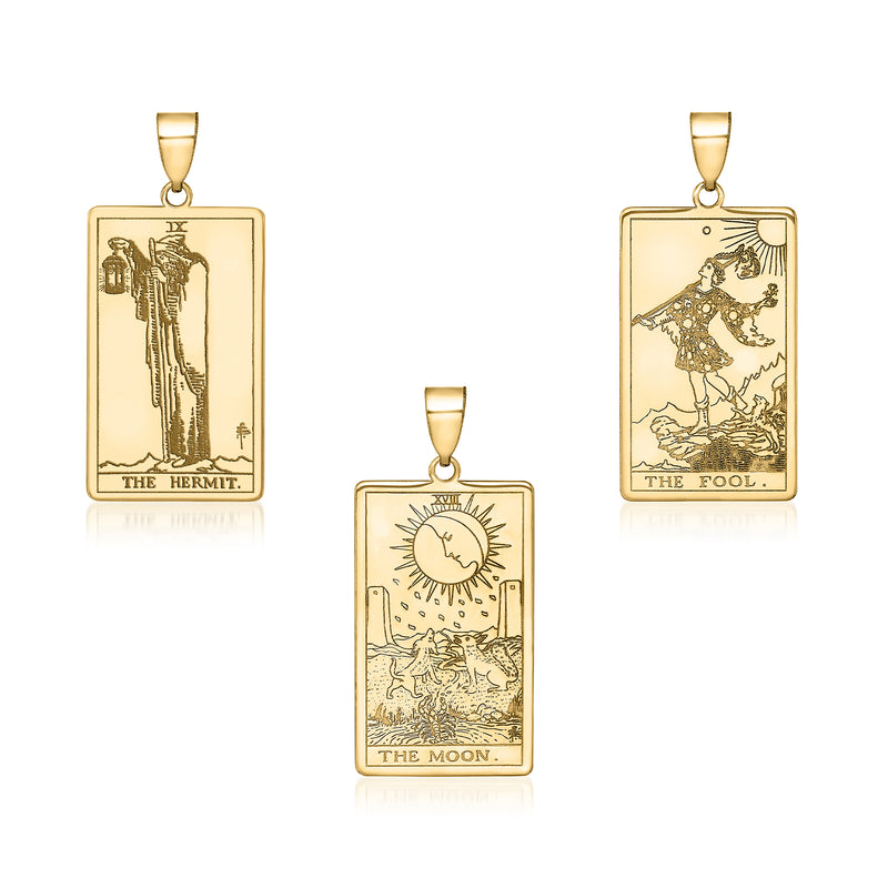 14kt yellow gold tarot card pendants: rectangular frames with The Hermit, The Fool, and The Moon.