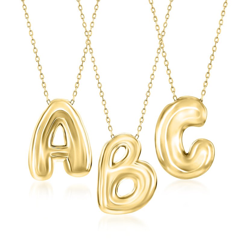 Gold bubble initial necklace with A, B, and C pendants on a chain