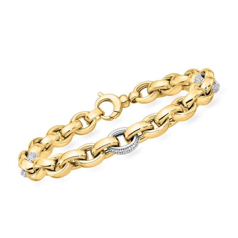 Two-tone gold cable-link station bracelet with diamond-encrusted oval segments