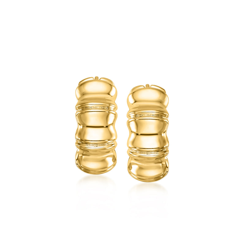 Bamboo-style yellow gold hoop earrings with grooved rounded segments, side view