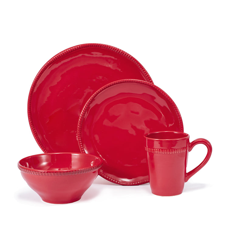 Red ceramic dinnerware set: large plates, bowls, and a mug.