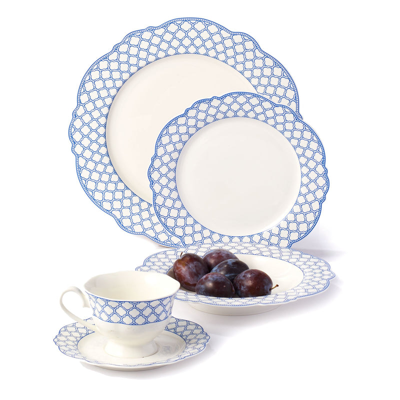 Scalloped bone china dinnerware set with blue lattice pattern; plates, cup and saucer.