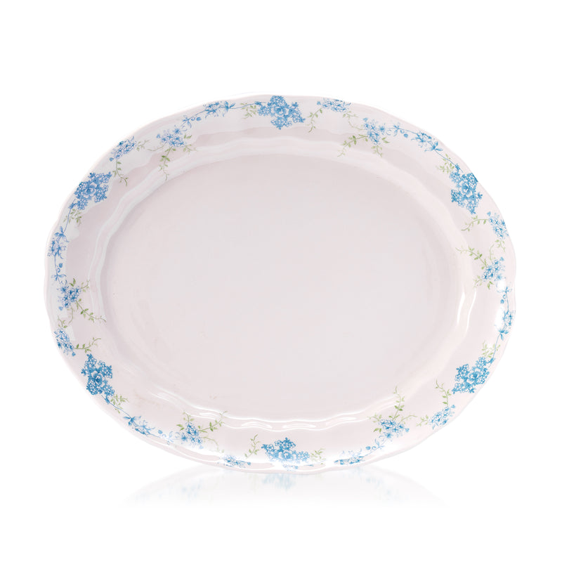 Oval stoneware dinner platter with white base and blue floral rim