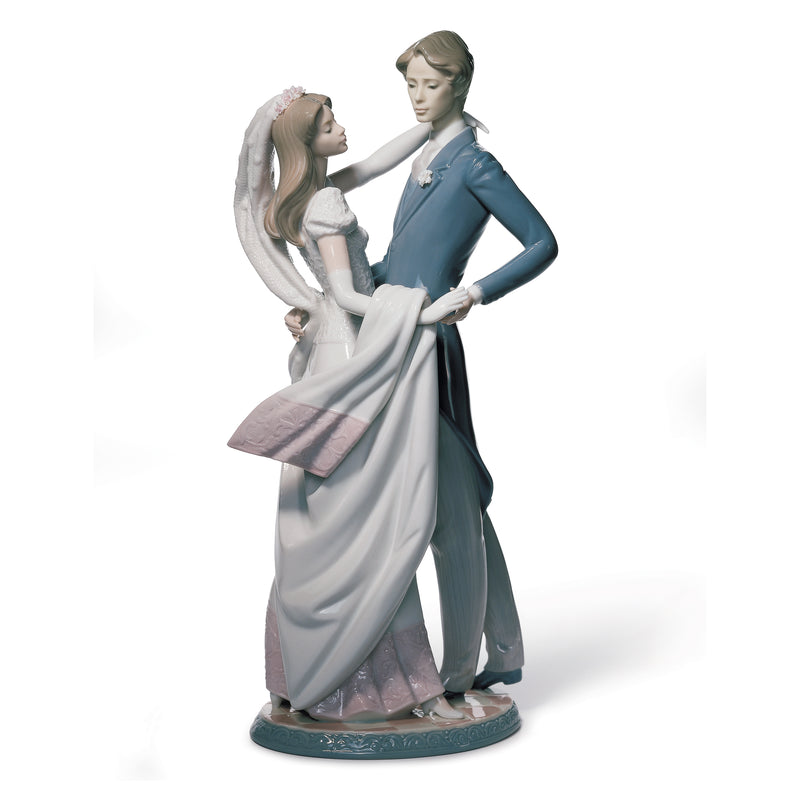 Lladro porcelain figurine of two women embracing, one in blue dress