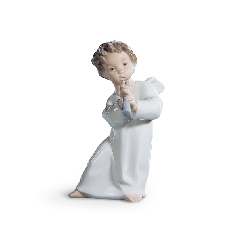 Lladro angel with horn porcelain figurine, kneeling child figure in white robe, holding hands