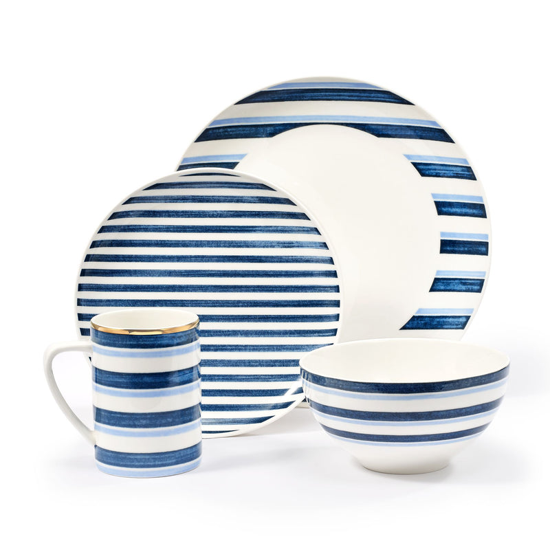 Blue-and-white porcelain dinnerware with striped plate, bowl, and pitcher