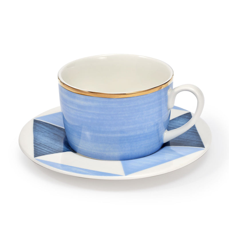 Blue porcelain cup and saucer with gold rim, white interior, geometric pattern
