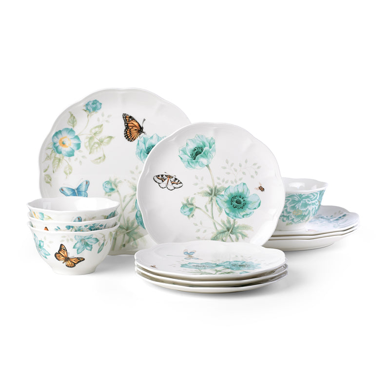 Porcelain dinnerware set with white plates and turquoise floral and butterfly design