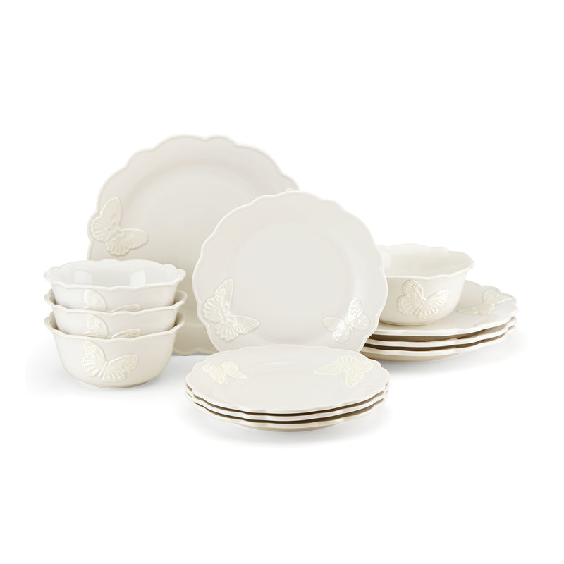 White stoneware dinnerware set with butterfly relief and scalloped plates, bowls
