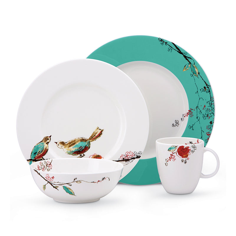 4-piece place setting with white plates and mug, turquoise plate back, bird and floral pattern