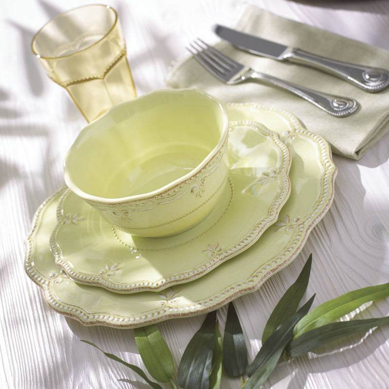 Kiwi green melamine dinnerware set with scalloped, embossed border plates and bowls