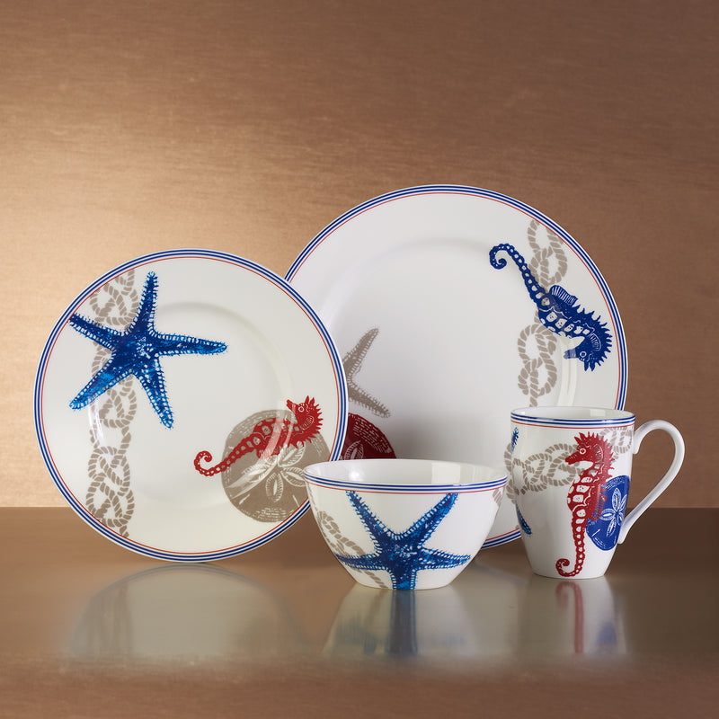 Nautical dinnerware set with blue starfish, red crab, and blue trim—service for 4