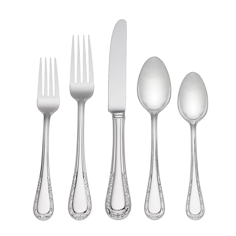 Stainless steel flatware set with ornate engraved handles, including forks, knife, and spoons