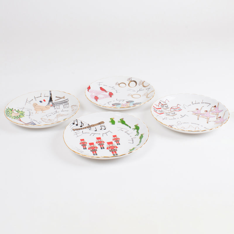 Set of 4 round Christmas dessert plates with colorful holiday illustrations