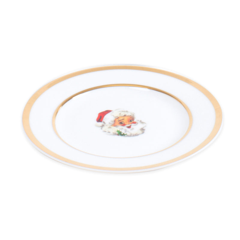 Round white dessert plate with gold rim and Santa portrait in center