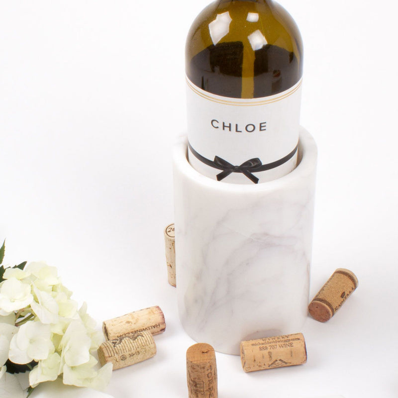 White marble wine chiller sleeve with bottle and CHLOE label, tied black ribbon