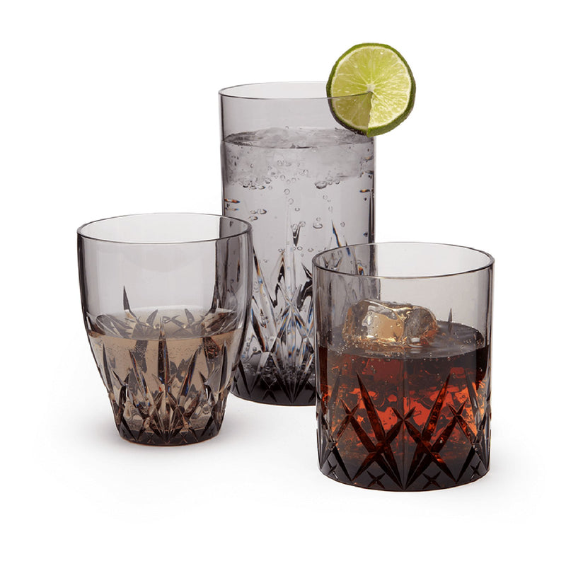 Gray acrylic tumbler glass set with faceted pattern, three cups and lemon slice garnish