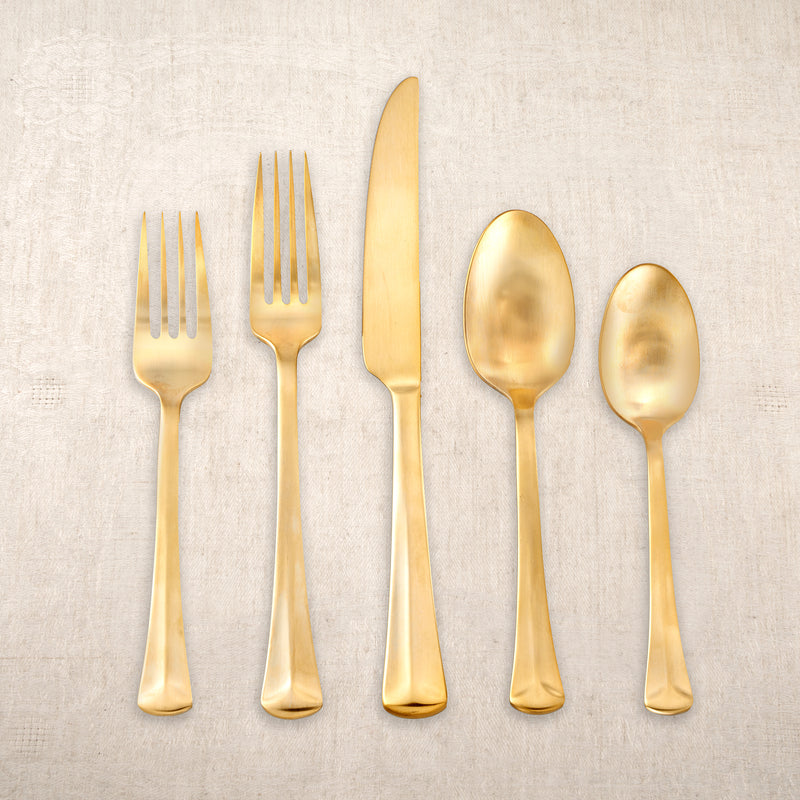 Reed & Barton gold-plated matte flatware set with fork, knife, and spoons