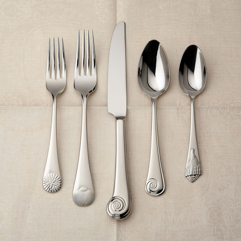 Reed & Barton 18/10 stainless steel flatware with seashell handle details, polished.