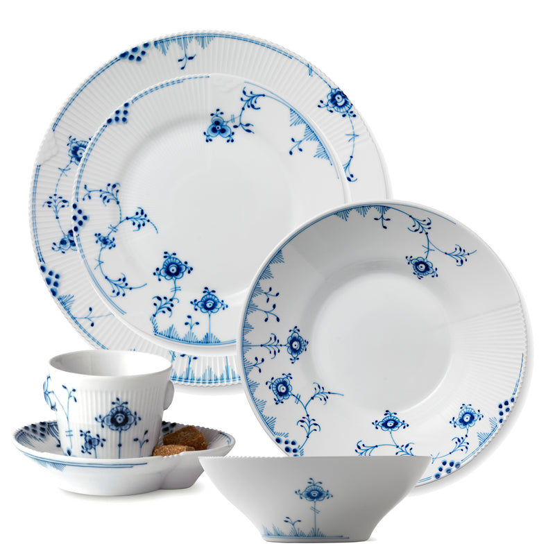 Blue floral porcelain dinnerware set with two plates and a cup and saucer