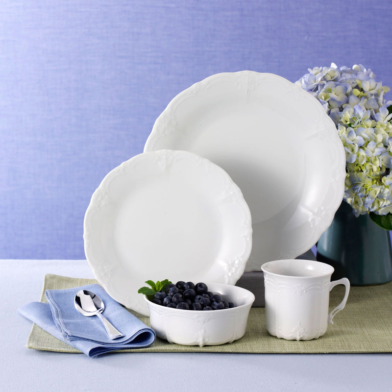 White porcelain dinnerware set: round bowls and cup for serving