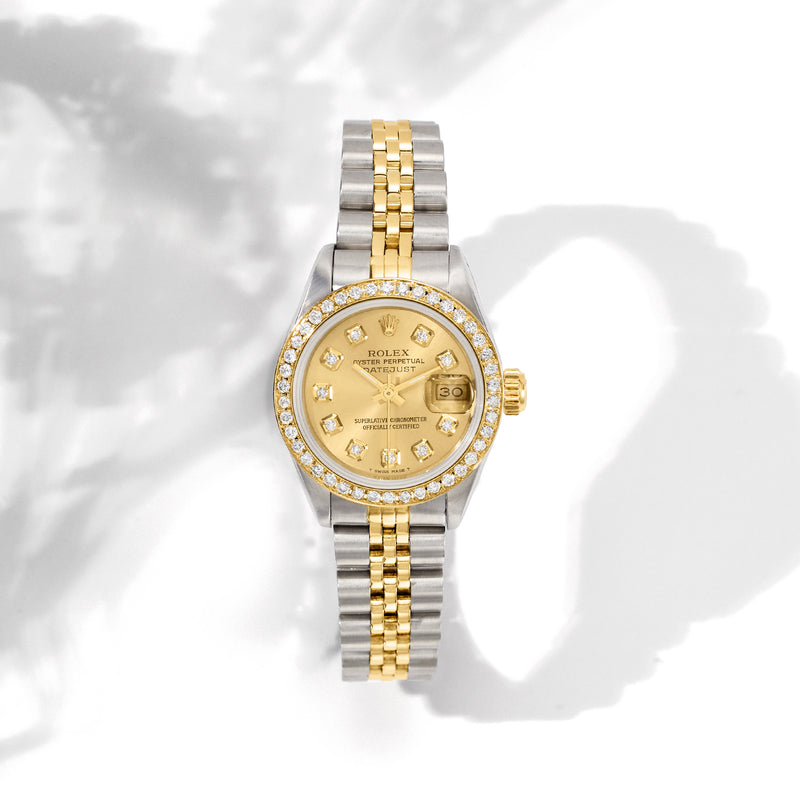 Rolex Datejust women's watch front view, diamond bezel, gold-and-steel bracelet, champagne dial