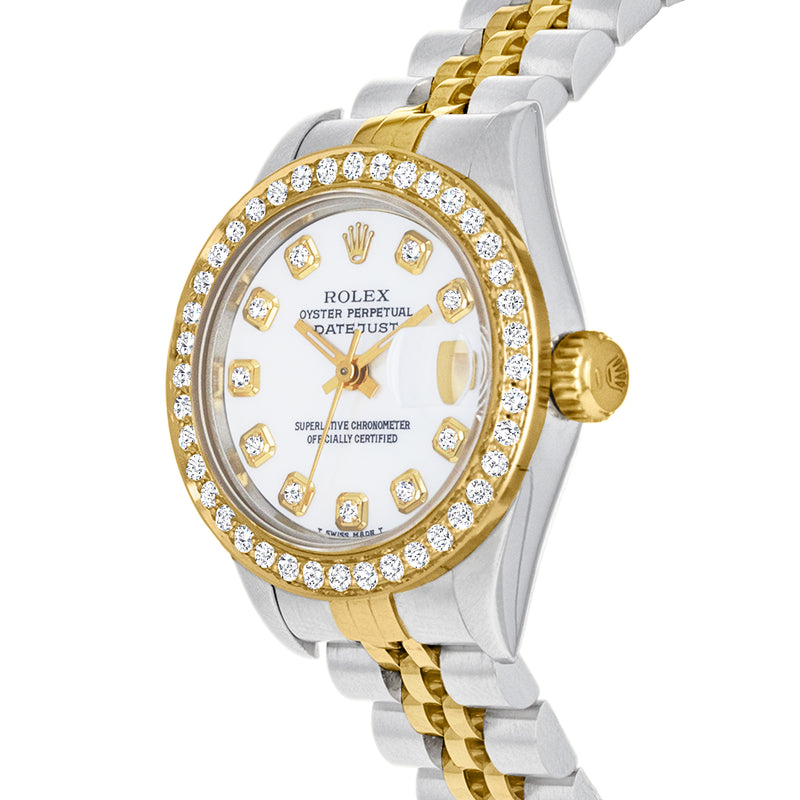 Two-tone watch close-up: white dial, diamond bezel, gold crown on stainless bracelet