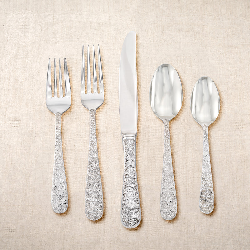 Towle Contessina flatware set with polished silver-tone forks, knives, and spoons.