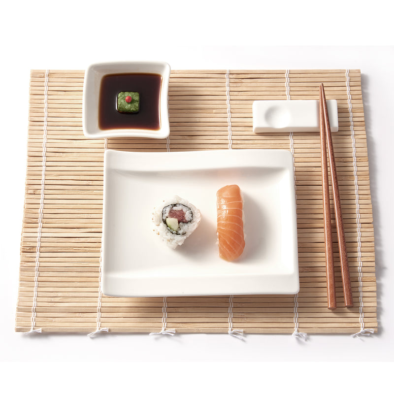 Square ceramic sushi set with white plates, brown soy sauce cup, chopsticks.