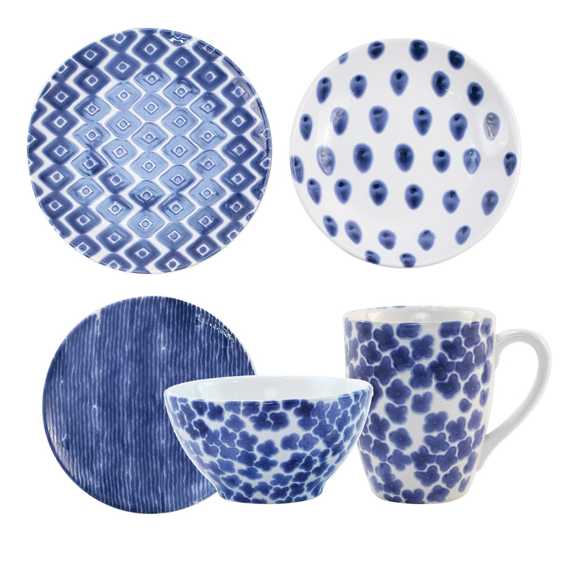 Assorted blue patterned dinnerware set: plates, bowls, and mugs with varied designs