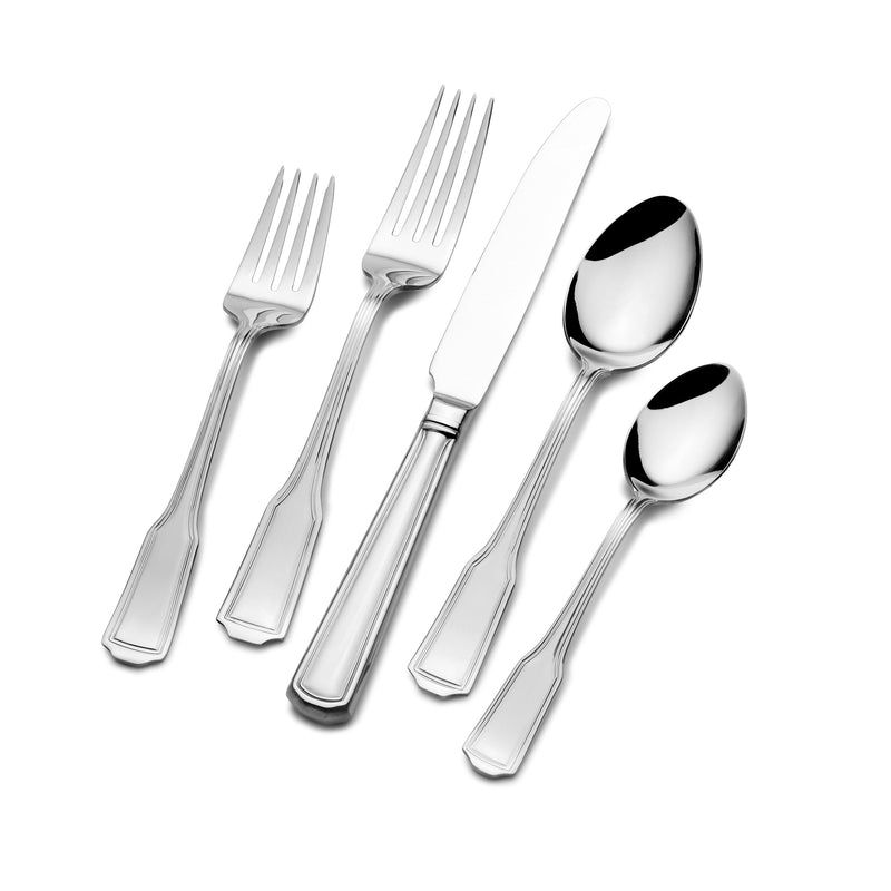 Silver-tone flatware set with forks, knives, and spoons, polished metal