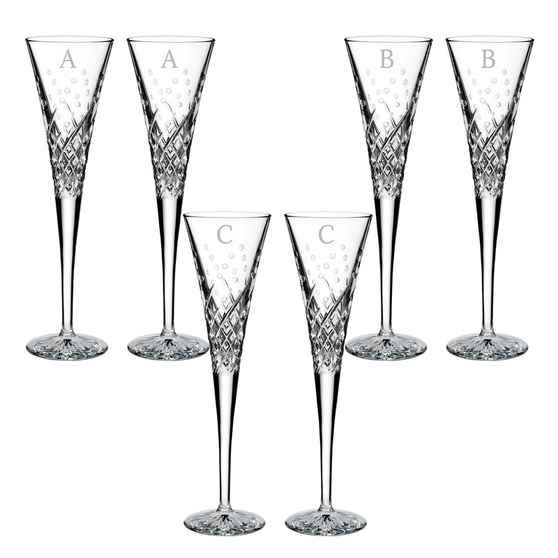 Crystal toasting flutes with block initial panels and diamond-cut detail (A/B/C shown)
