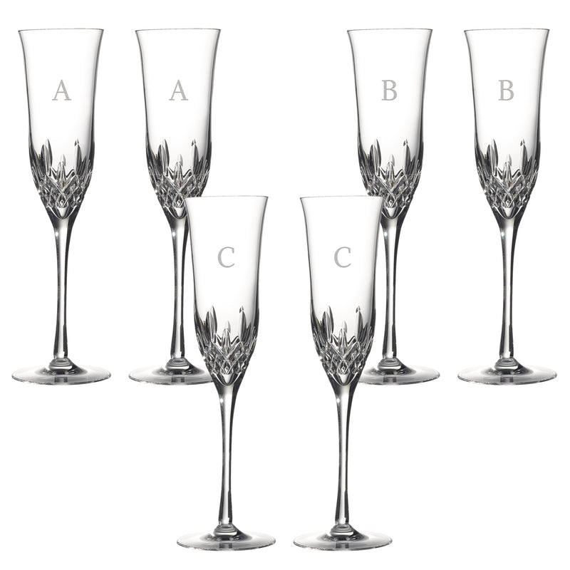 Cut crystal toasting flutes with etched block initial letters A, B, and C