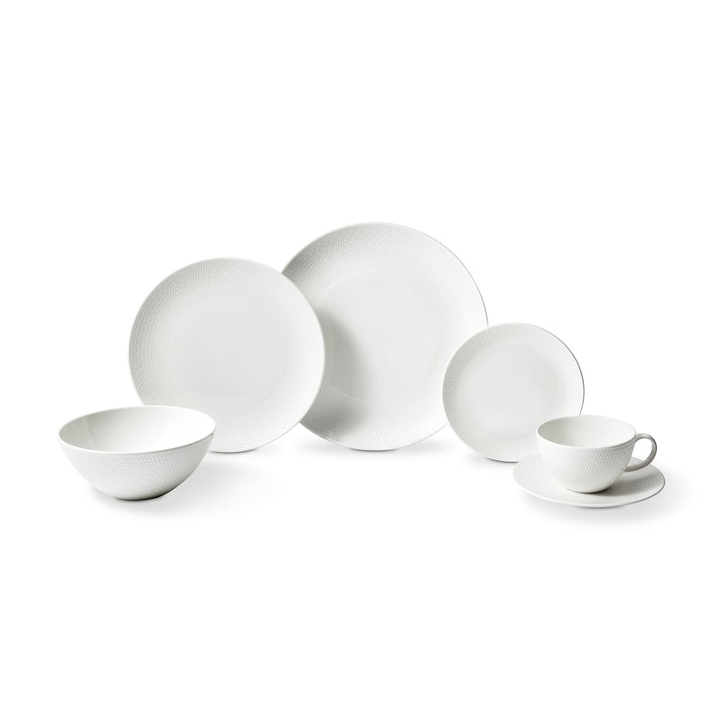 Wedgwood Gio white dinnerware set with plates, bowls, and teacup saucer pairs
