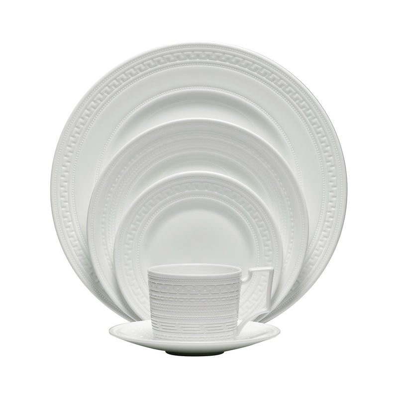 Wedgwood Intaglio white porcelain dinnerware set with embossed rim and cup