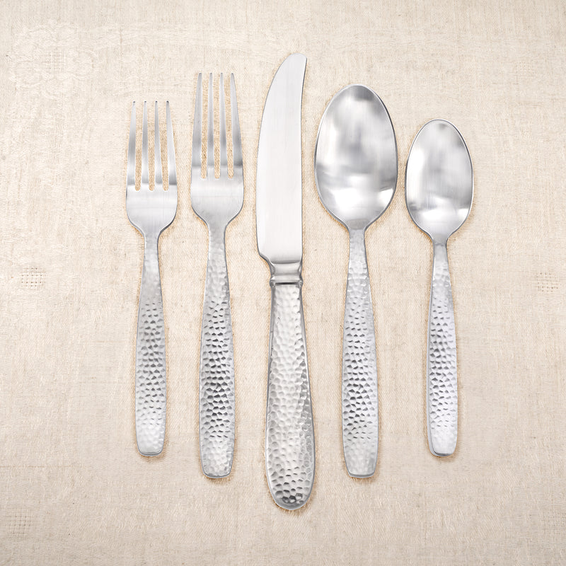 Stainless steel flatware set with forks, knife, and two spoons
