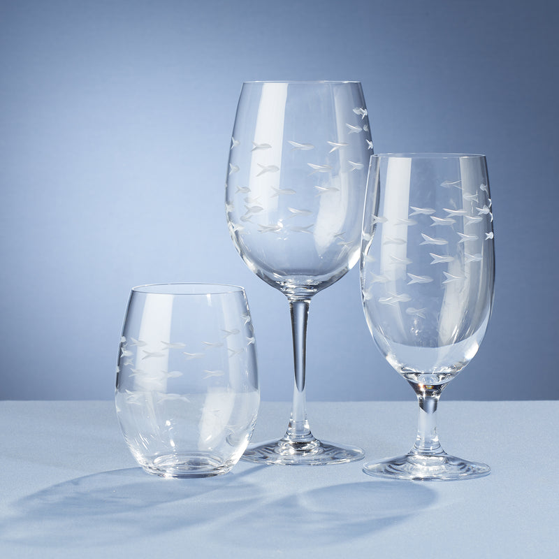 4-piece clear drinkware set with fish silhouettes on stemmed and stemless glasses