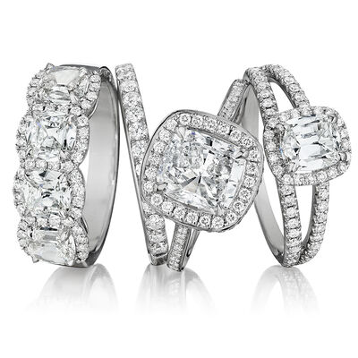 Henri Daussi. Image Featuring Three Diamond Rings in White Gold.