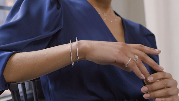 New! Fine Jewelry Collection. Image Featuring Model Wearing Rings and Bracelets