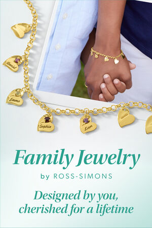 Family Jewelry by Ross-Simons. Designed by you, delivered within ten days. Image Featuring a mother and son holding hands, with a gold heart charm bracelet laid over the top.