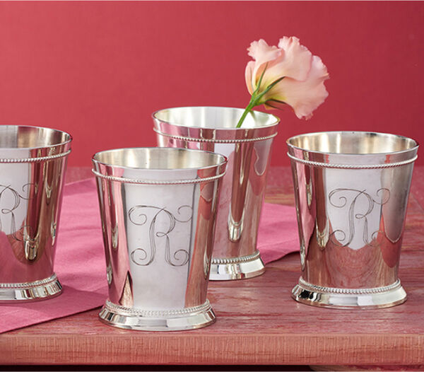 A Personal Touch. Image featuring Sterling Silver Cups on a red background