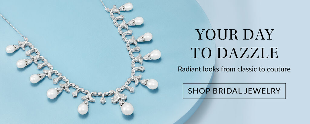 Your day to dazzle. Radiant looks from classic to couture. Shop bridal jewelry. Image of diamond earrings and pearl necklace.