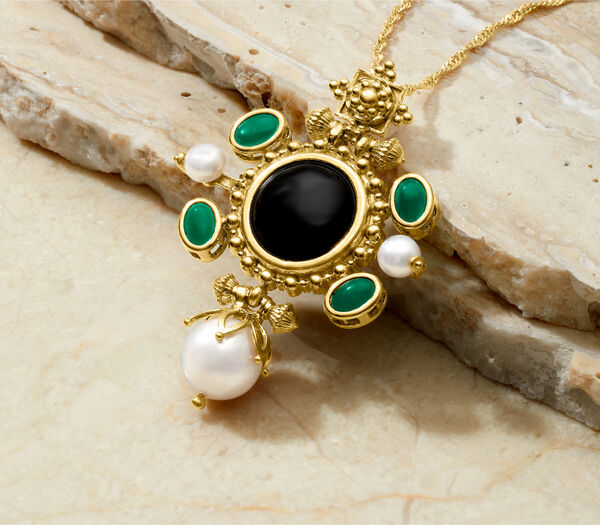 Opulent Beauty. Indulge in stunning jewels. Image featuring a pendant necklace over white marble