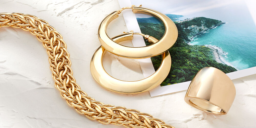 Italian Gold Necklace, Earrings and Ring on Photo of Italian Coastline